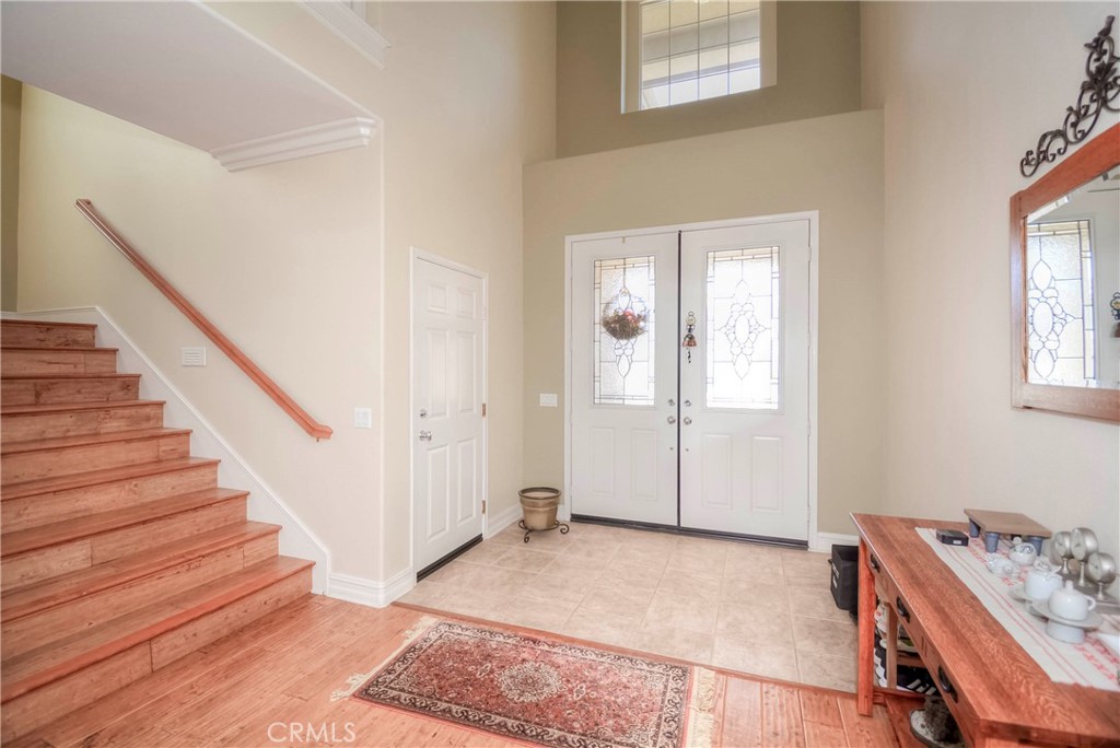 45316 St Tisbury Street Temecula, CA 92592 - Photo 9 of 62 a view of a livingroom with wooden floor and stairs
