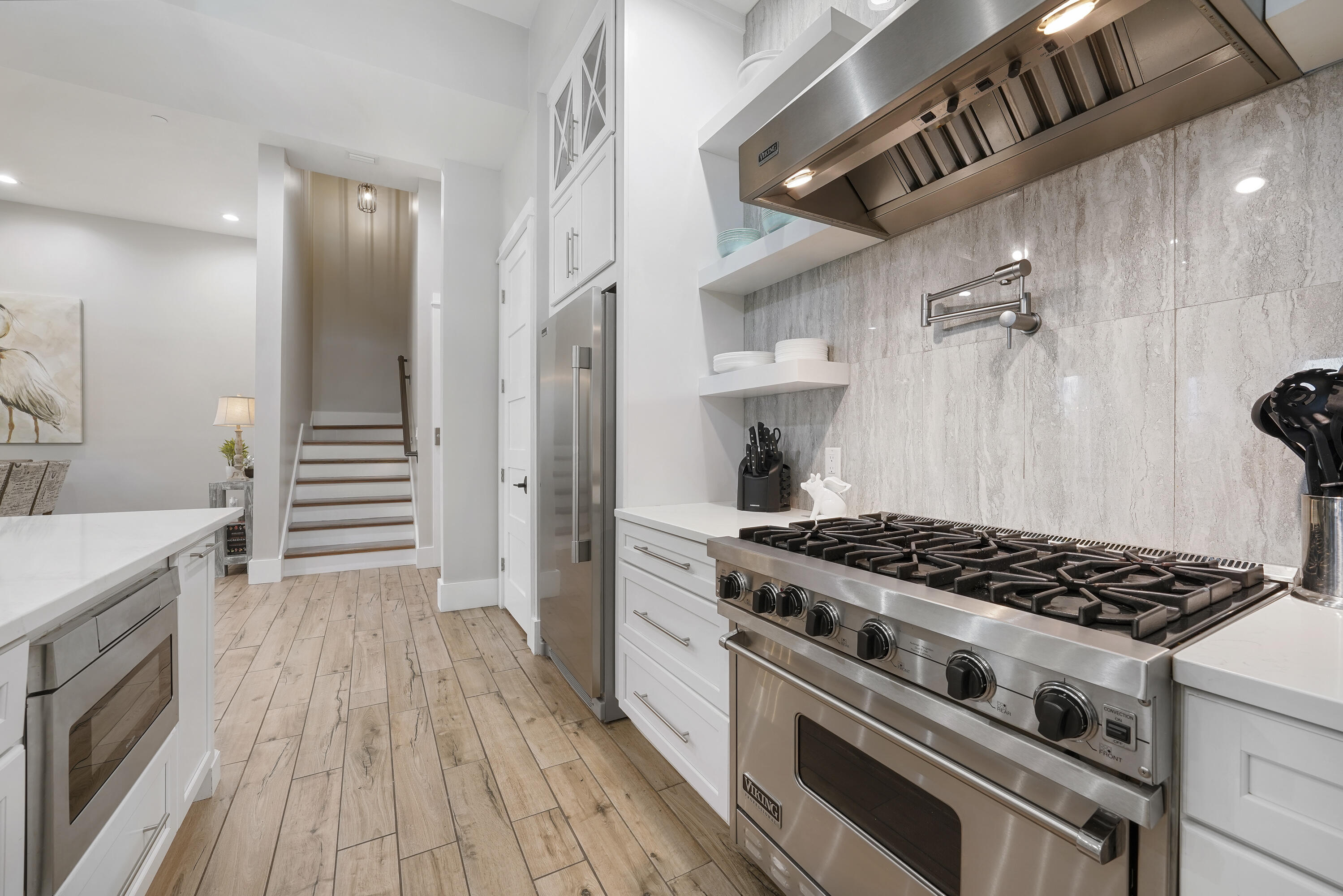 10 Walton Drive Miramar Beach, FL 32550 - Photo 26 of 80 a kitchen with granite countertop a stove and a wooden floor
