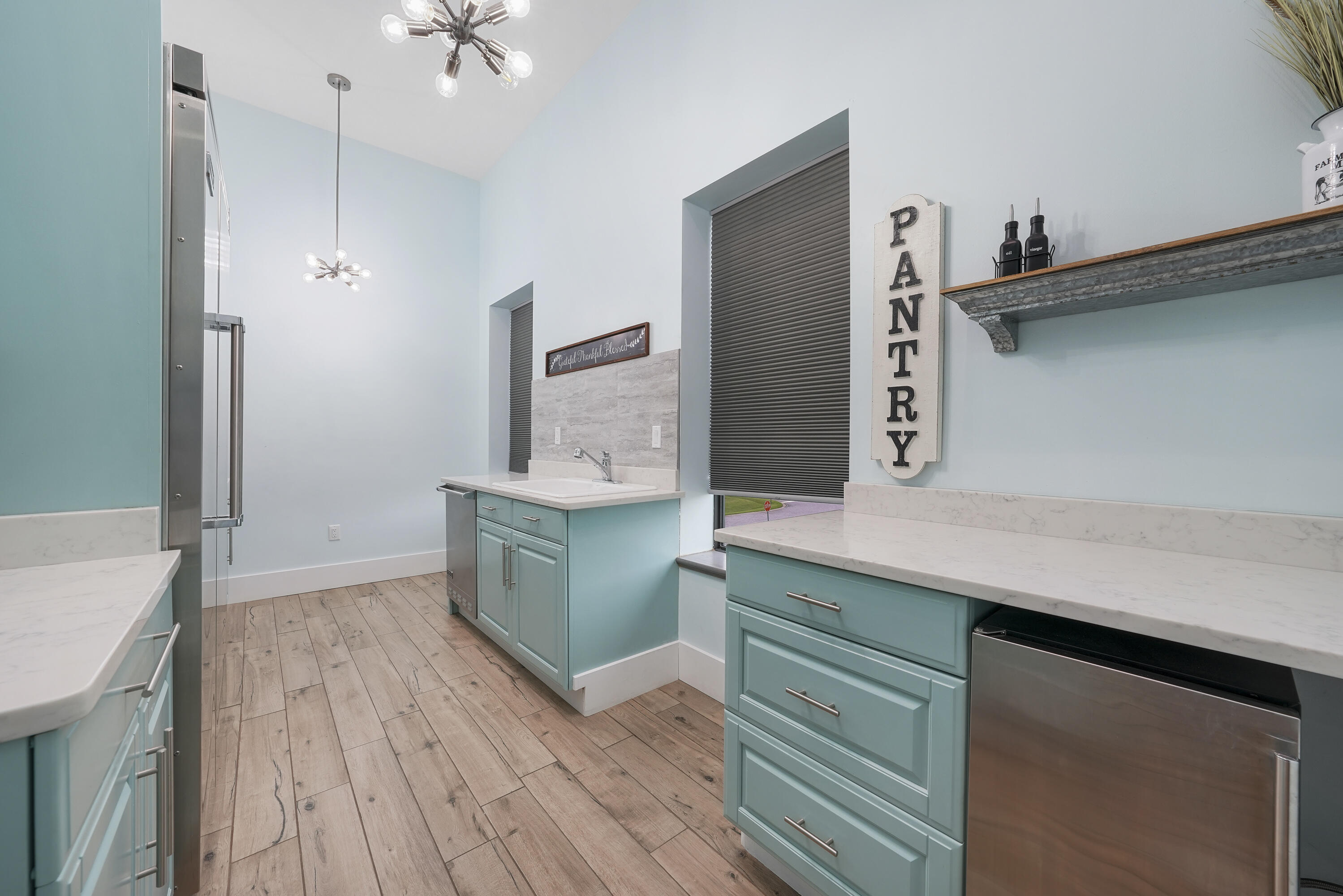 10 Walton Drive Miramar Beach, FL 32550 - Photo 28 of 80 a kitchen with a wooden floor and cabinets