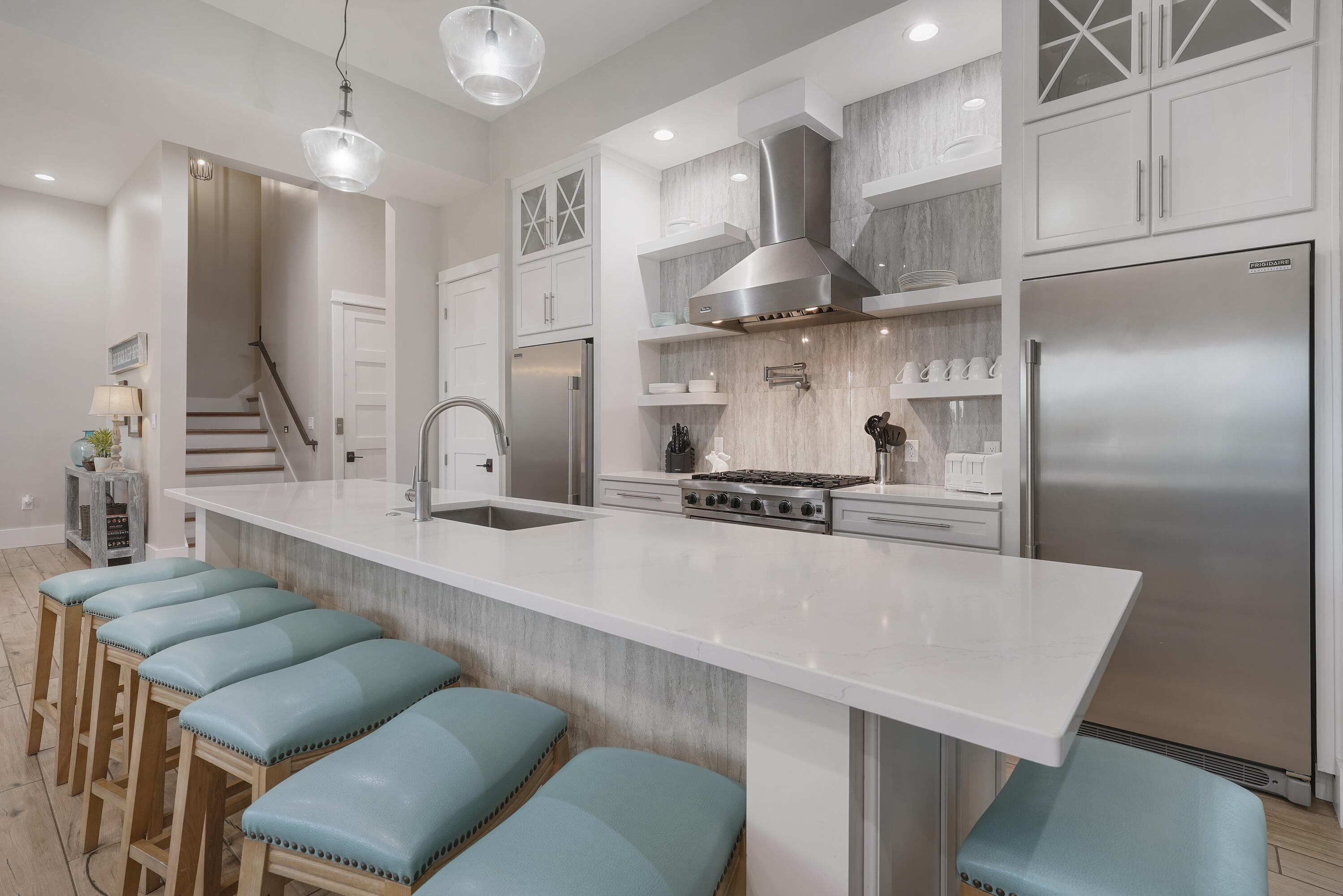 10 Walton Drive Miramar Beach, FL 32550 - Photo 32 of 80 a large kitchen with kitchen island a large counter space a sink stainless steel appliances and cabinets