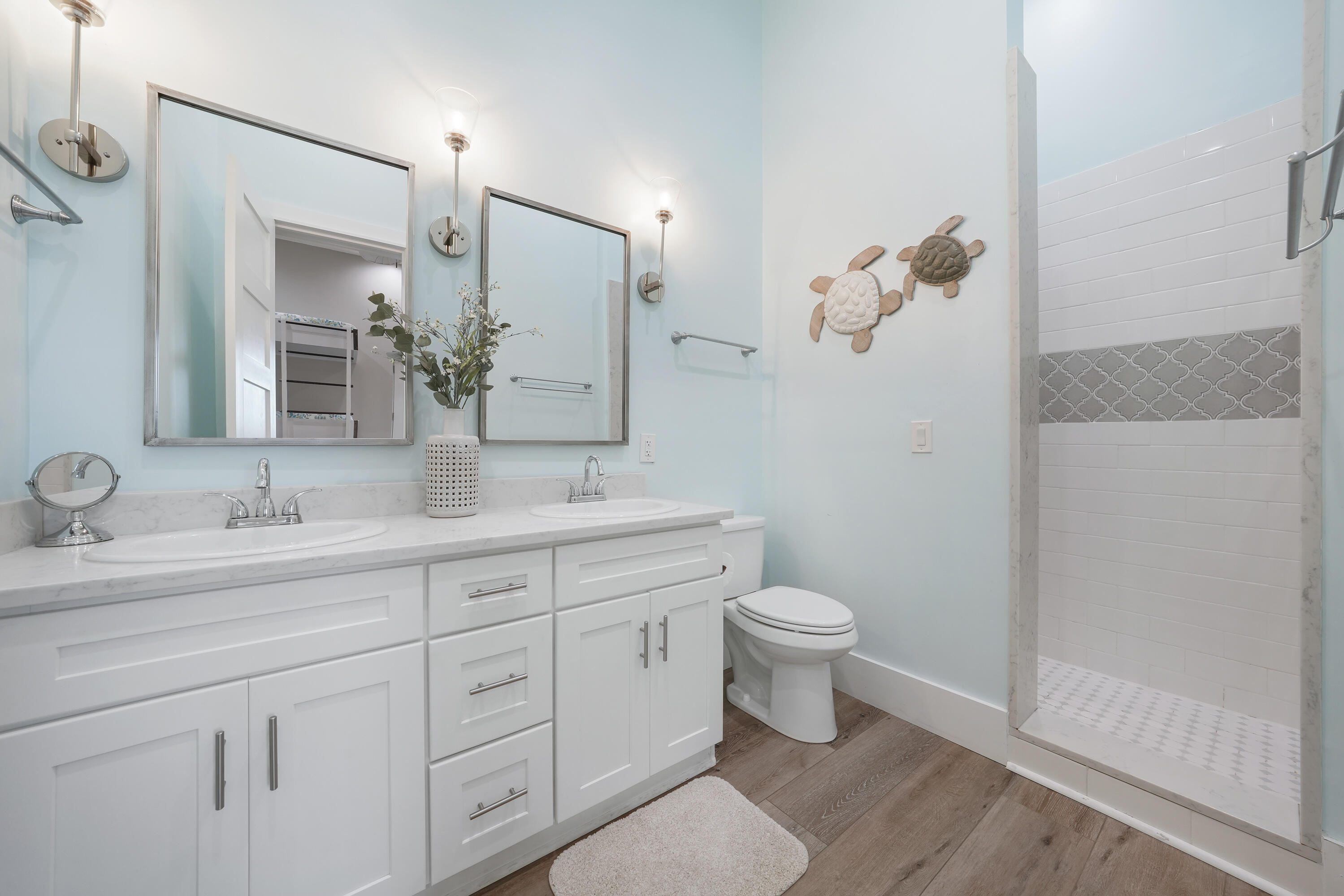 10 Walton Drive Miramar Beach, FL 32550 - Photo 56 of 80 a bathroom with a granite countertop sink a toilet and a mirror