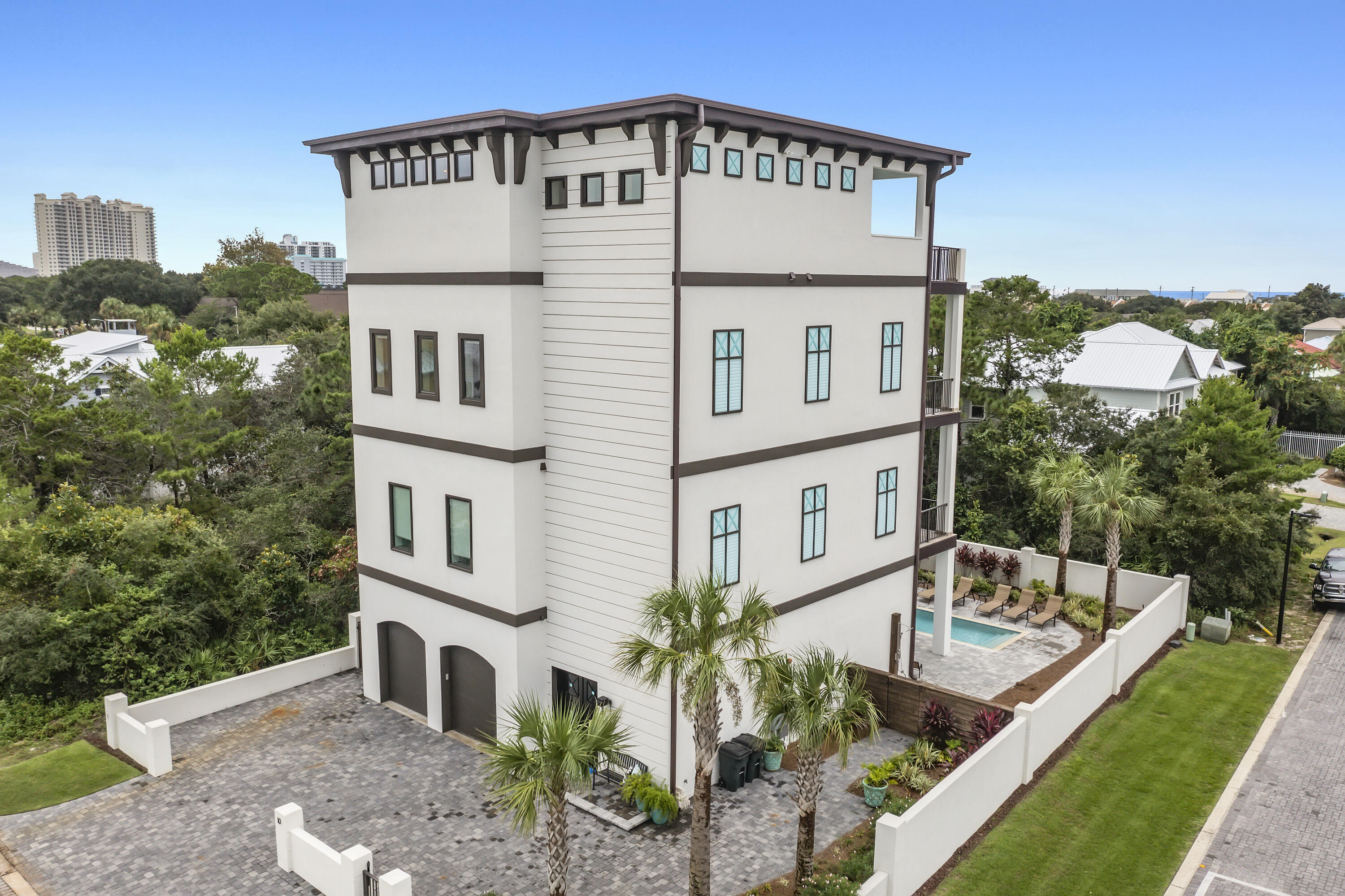 10 Walton Drive Miramar Beach, FL 32550 - Photo 80 of 80 a view of a white house with a yard plants and large tree