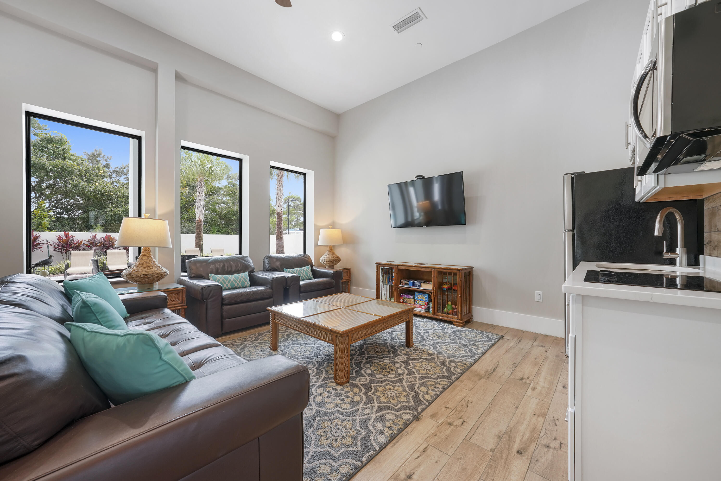 10 Walton Drive Miramar Beach, FL 32550 - Photo 9 of 80 a living room with furniture a large window and a flat screen tv