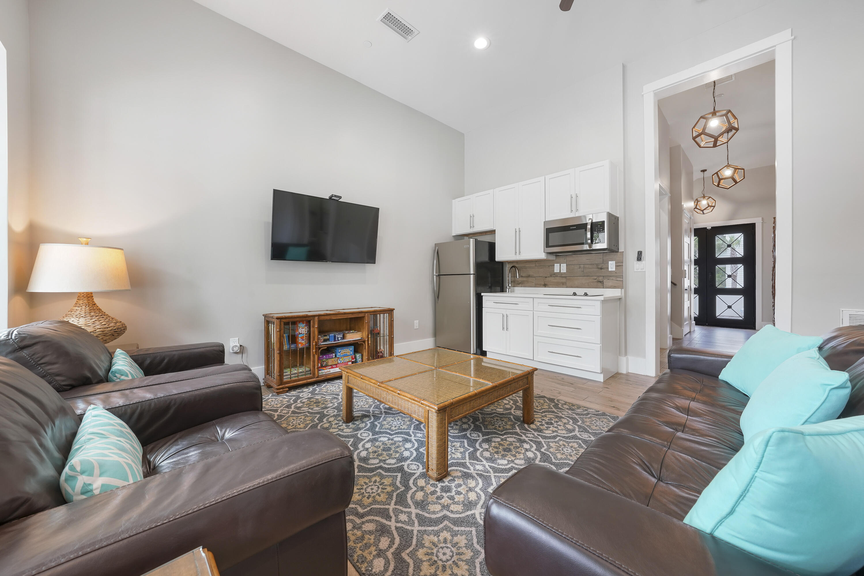 10 Walton Drive Miramar Beach, FL 32550 - Photo 10 of 80 a living room with furniture a flat screen tv and a fireplace
