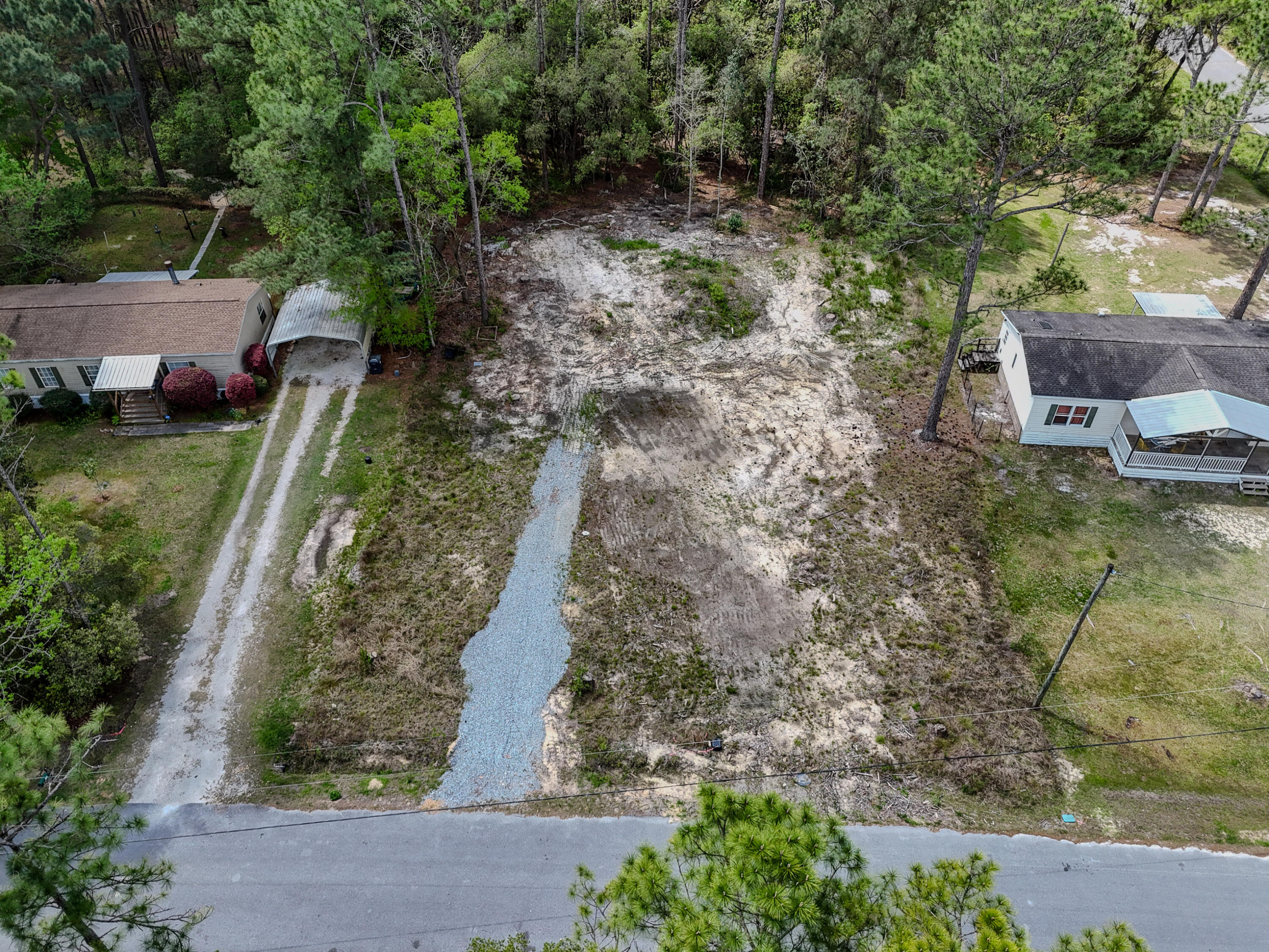 164 Memorial Lane Freeport, FL 32439 - Photo 2 of 11 a backyard of a house with lots of green space