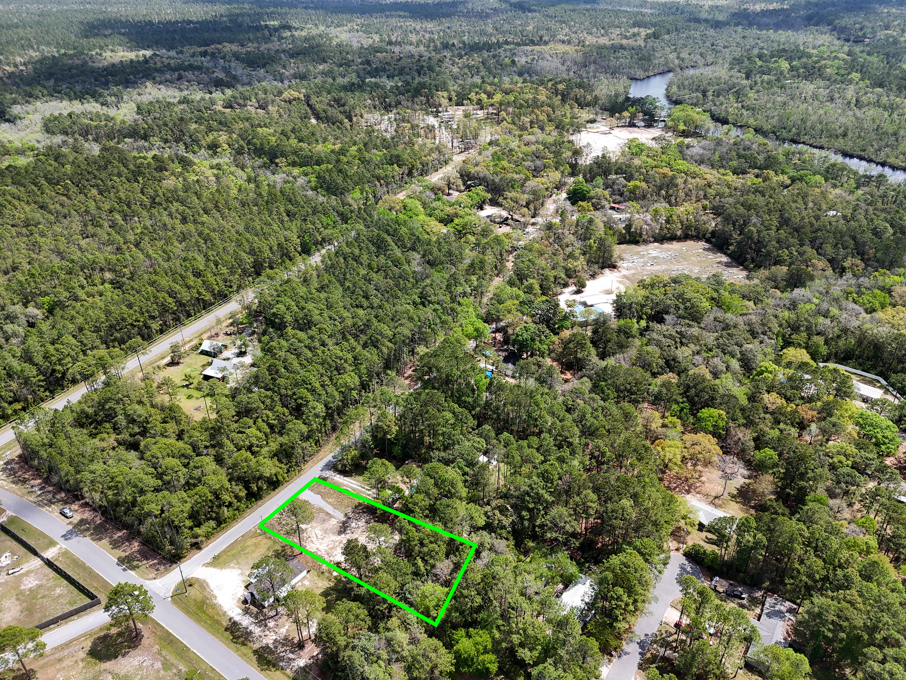 164 Memorial Lane Freeport, FL 32439 - Photo 4 of 11 a view of a yard with plants