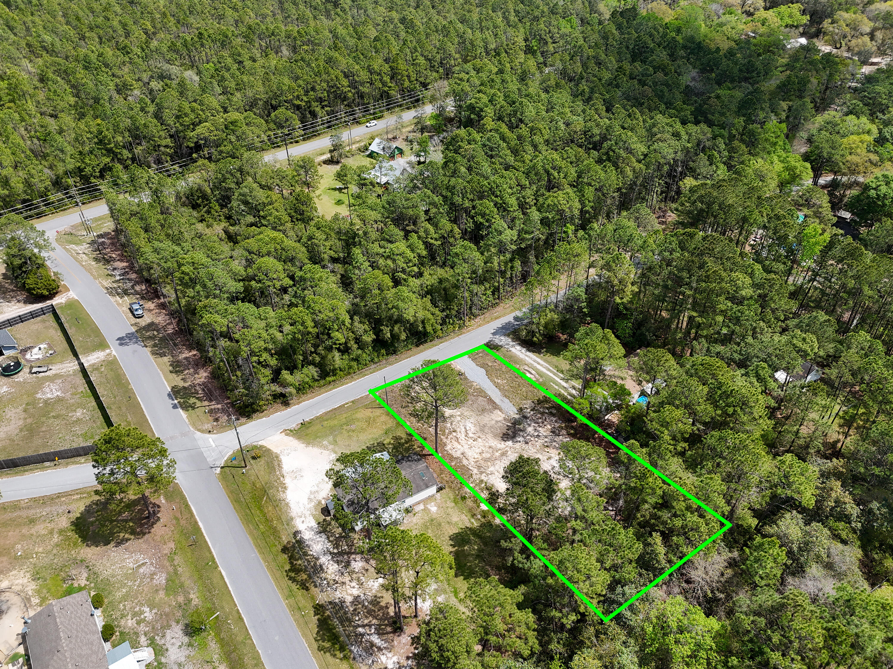 164 Memorial Lane Freeport, FL 32439 - Photo 9 of 11 a view of a yard with plants