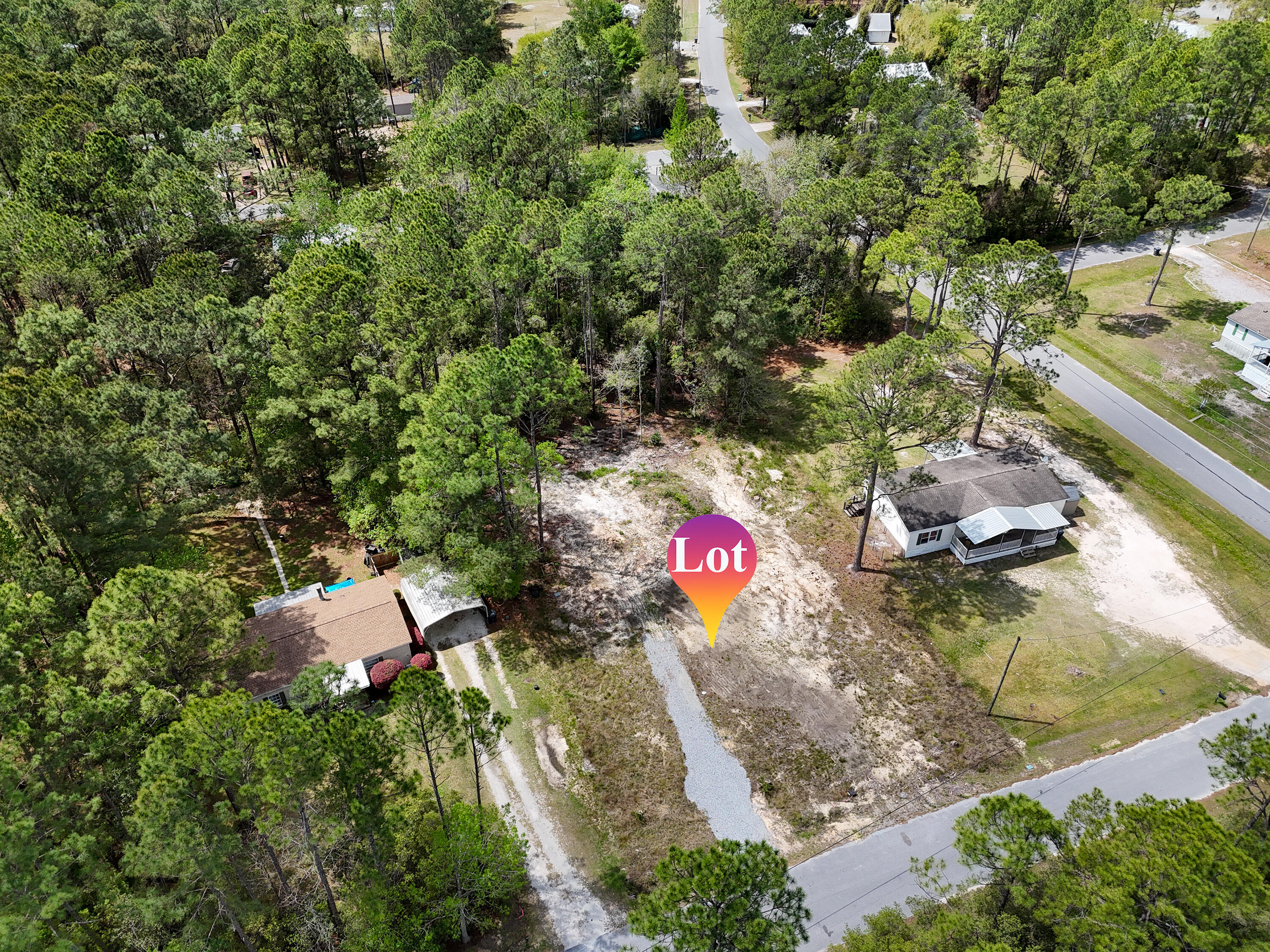 164 Memorial Lane Freeport, FL 32439 - Photo 10 of 11 an aerial view of a house with a yard and lake view