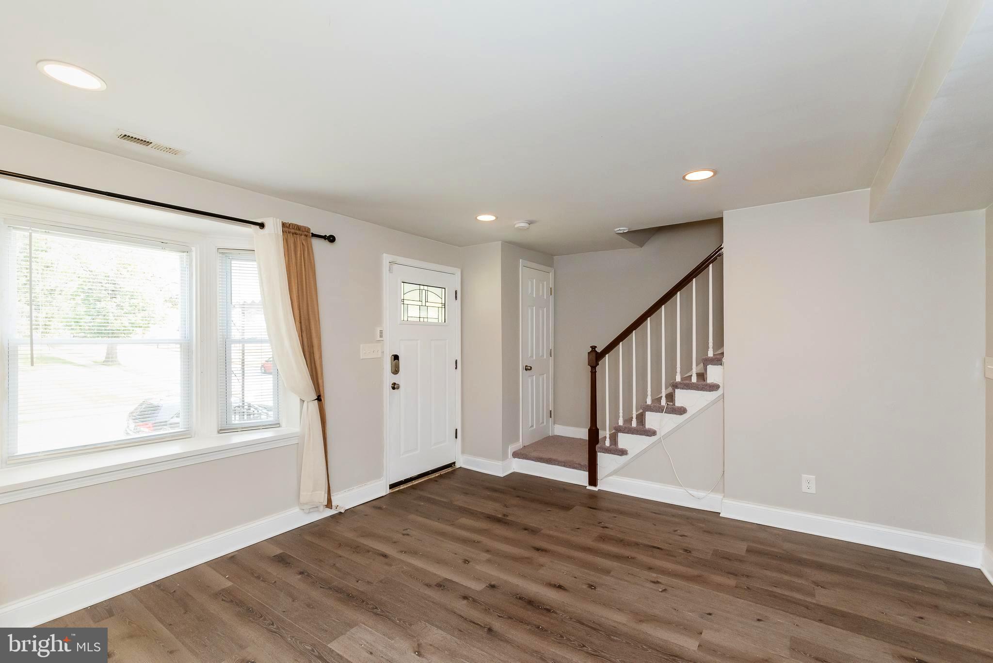 1811 Ramblewood Road Baltimore, MD 21239 - Photo 2 of 28 LIVING ROOM W/HUGE WINDOW