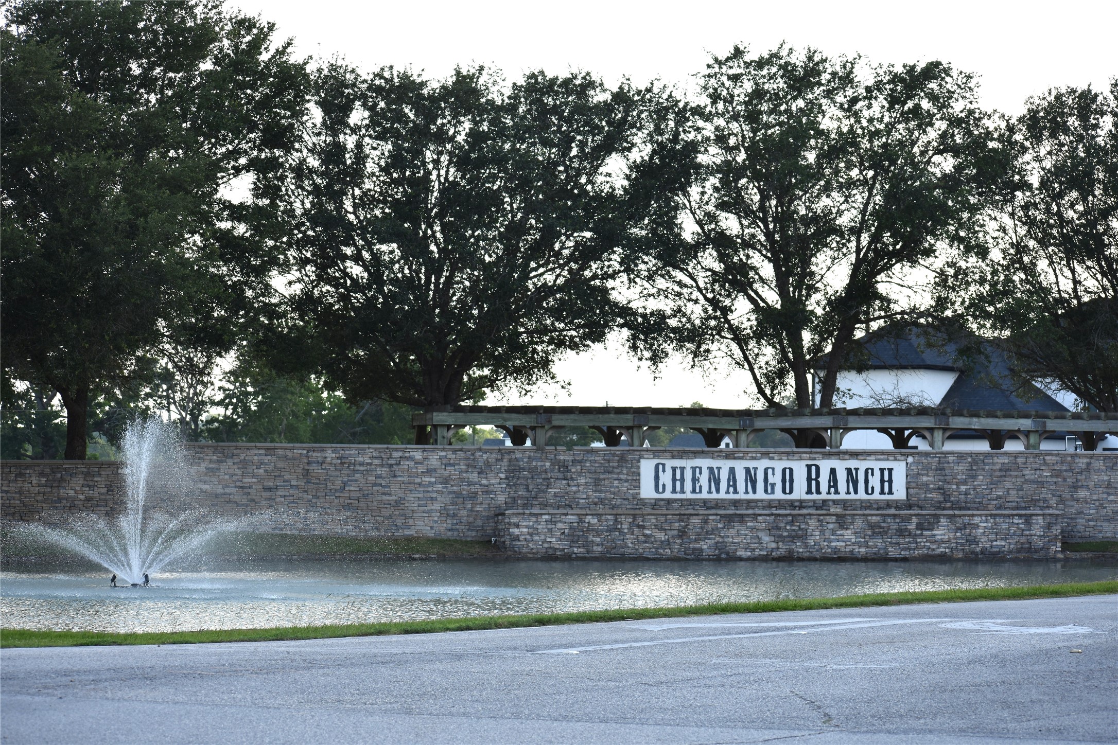 23210 FM 521 Road Angleton, TX 77515 - Photo 13 of 23 a view of a street sign under a large tree