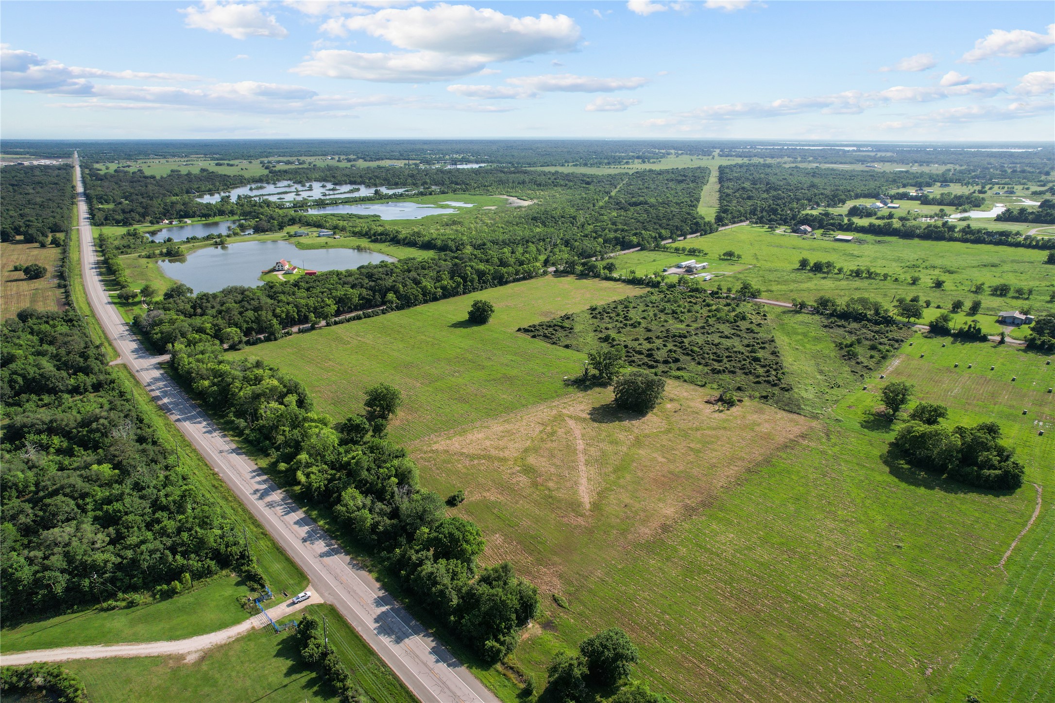 23210 FM 521 Road Angleton, TX 77515 - Photo 3 of 23 a view of a lake with a yard