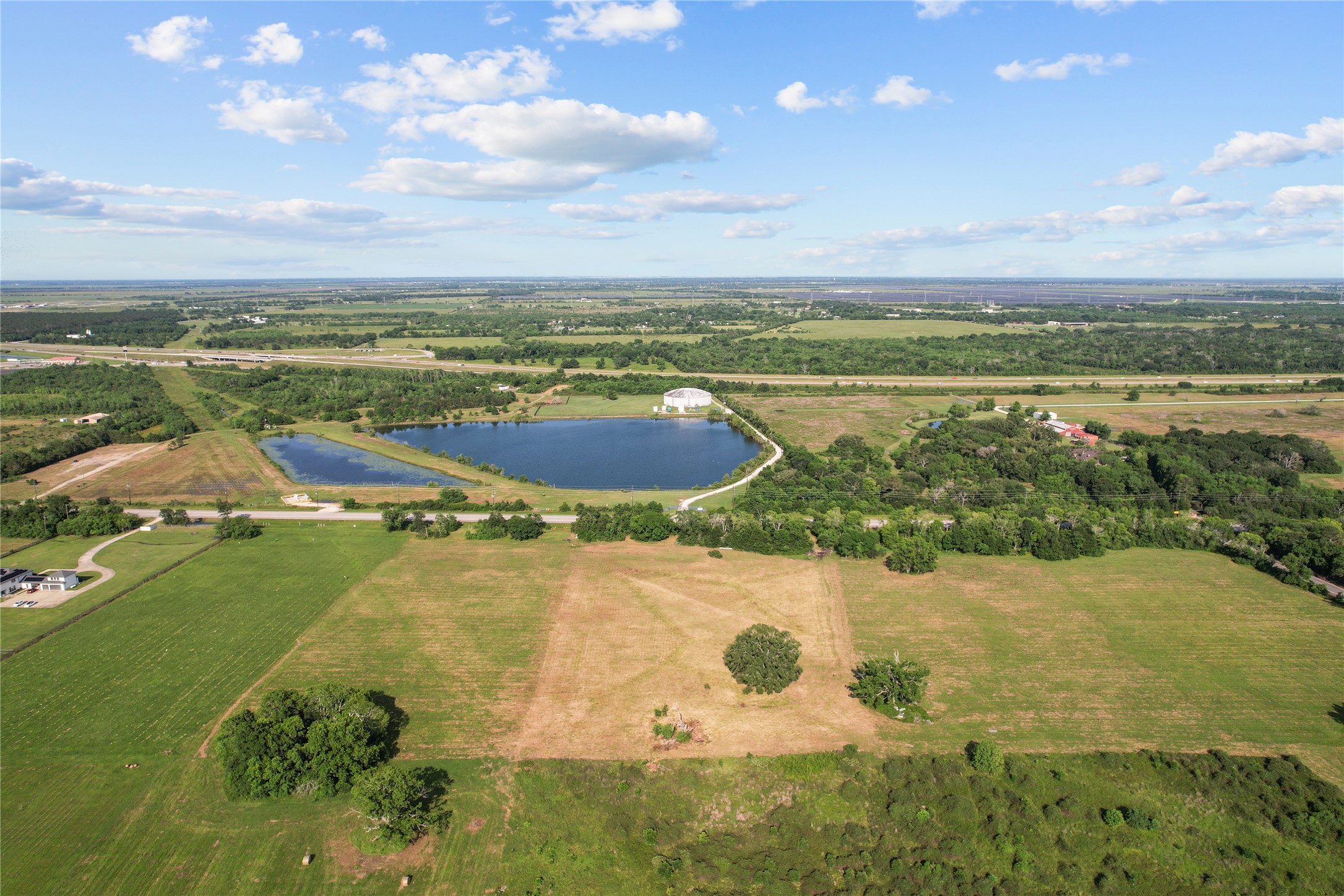 23210 FM 521 Road Angleton, TX 77515 - Photo 10 of 23 a view of a lake with a yard