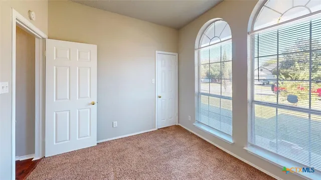 an empty room with windows