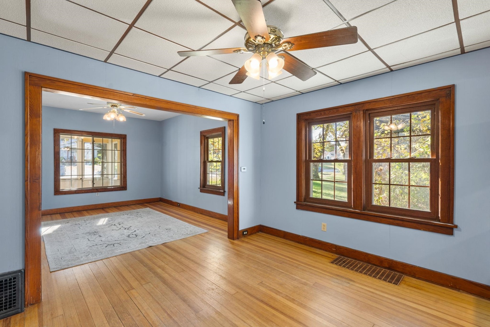 313 North 20th Street East Moline, IL 61244 - Photo 5 of 13 a view of an empty room with a window and wooden floor