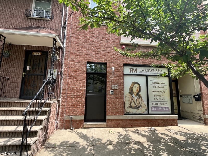 157 Lafayette Street, Unit 2 Newark, NJ 07105 - Photo 1 of 12 a front view of a house with parking area