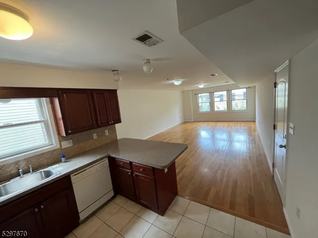 a kitchen with a wooden cabinets and a sink
