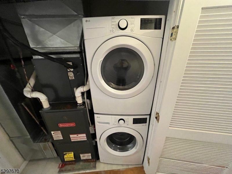 157 Lafayette Street, Unit 2 Newark, NJ 07105 - Photo 9 of 12 a utility room with dryer and washer
