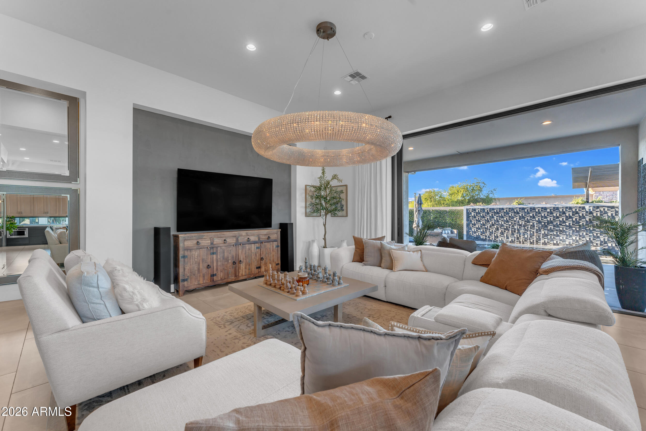 3908 East Alameda Lane Gilbert, AZ 85298 - Photo 18 of 62 a living room with furniture and a flat screen tv