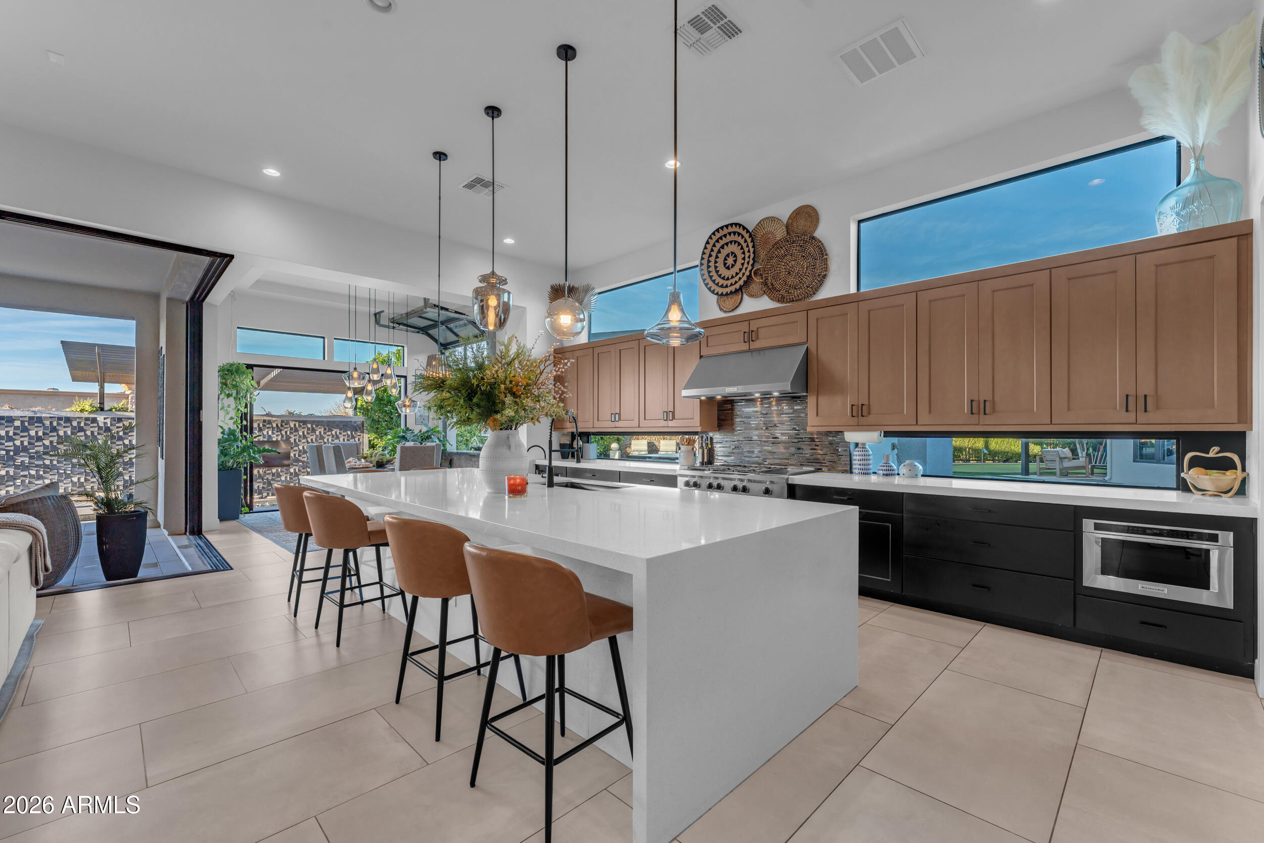 3908 East Alameda Lane Gilbert, AZ 85298 - Photo 20 of 62 a kitchen with kitchen island granite countertop a sink a counter top space appliances and cabinets