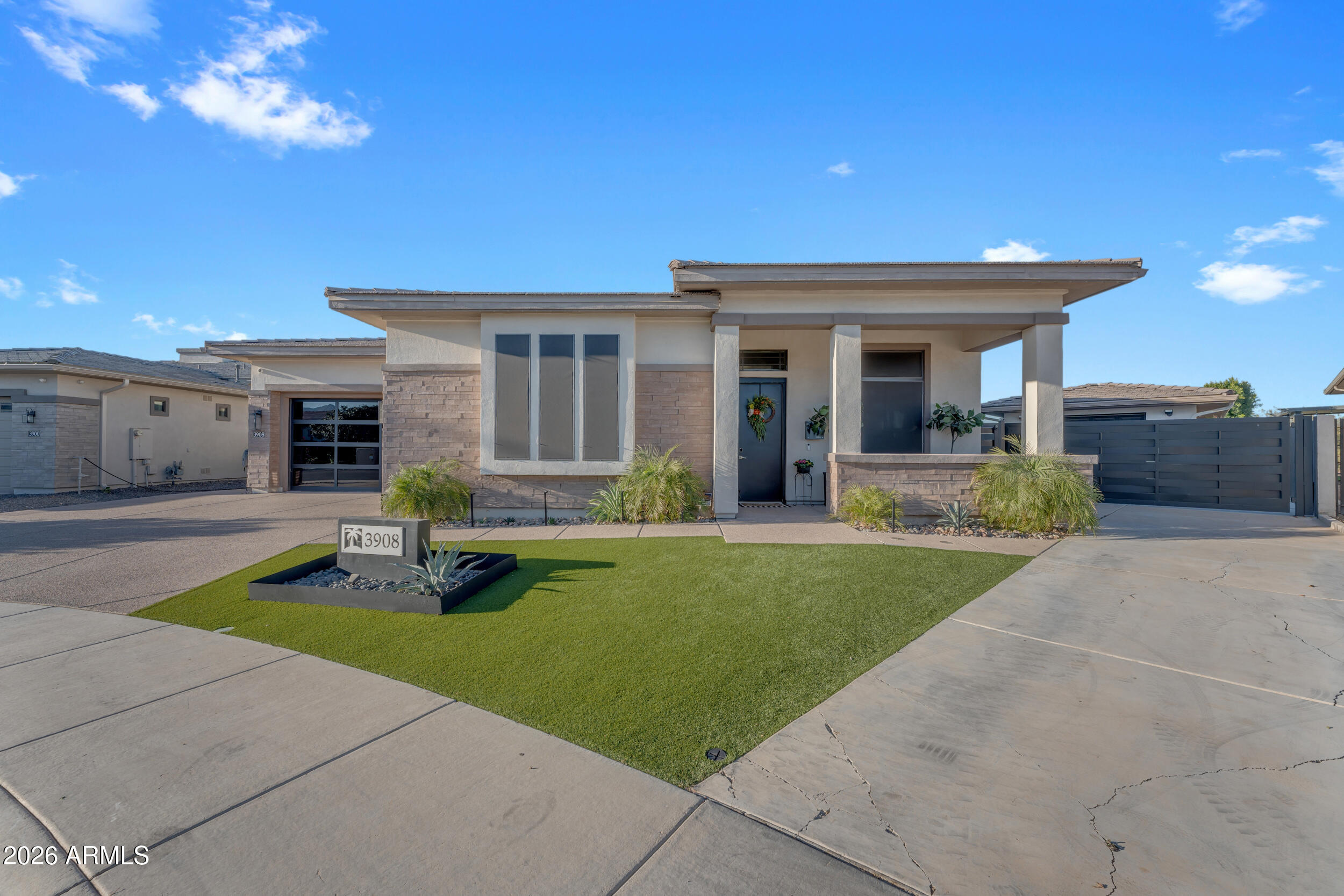 3908 East Alameda Lane Gilbert, AZ 85298 - Photo 2 of 62 a front view of house with yard and green space
