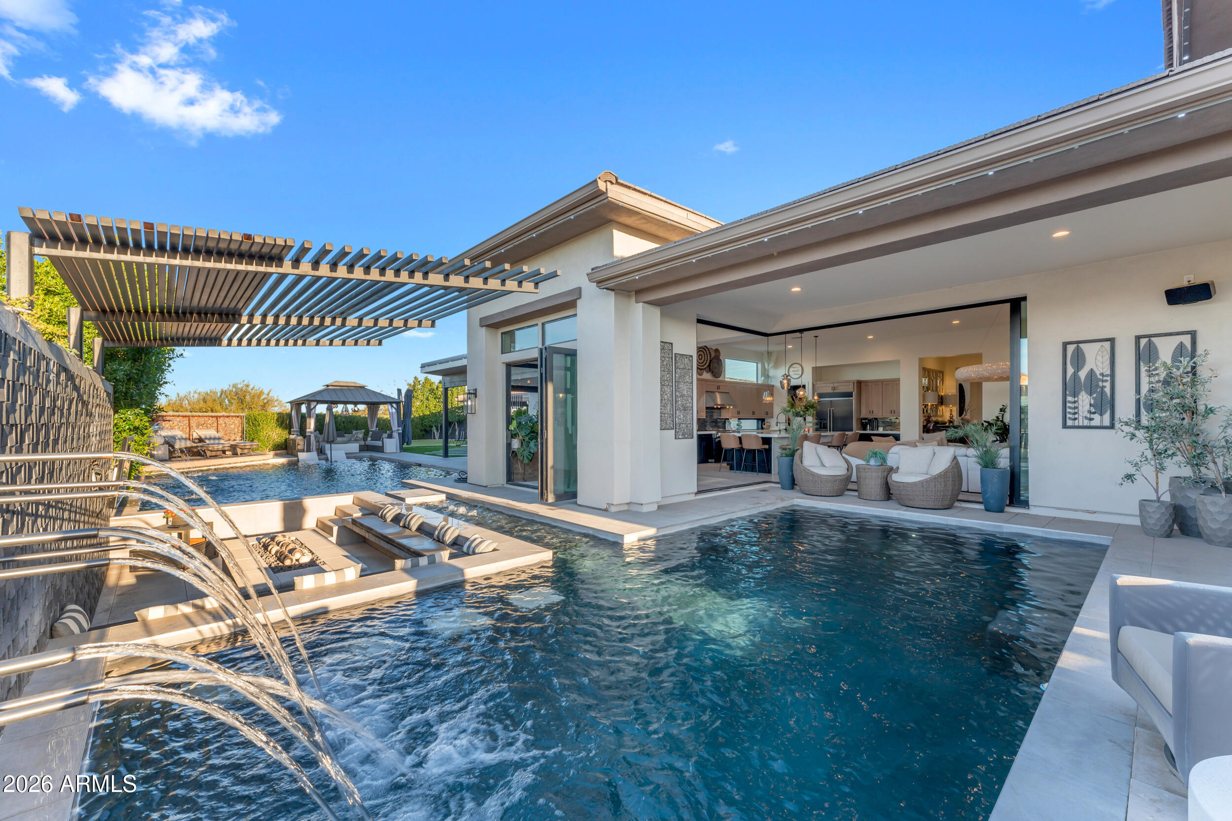 3908 East Alameda Lane Gilbert, AZ 85298 - Photo 33 of 62 a view of a patio with couches chairs and potted plants