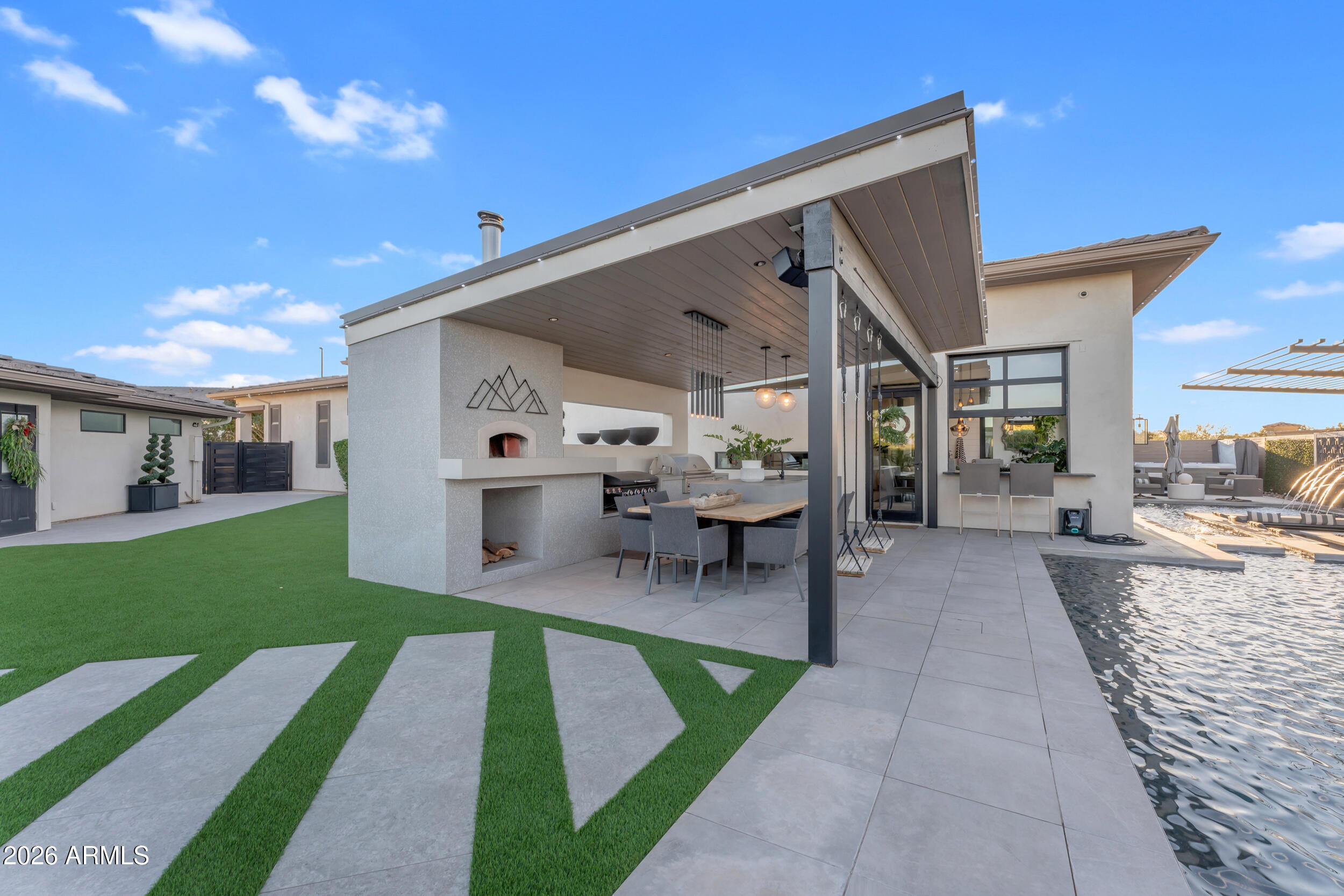 3908 East Alameda Lane Gilbert, AZ 85298 - Photo 39 of 62 a view of a porch with furniture and a yard