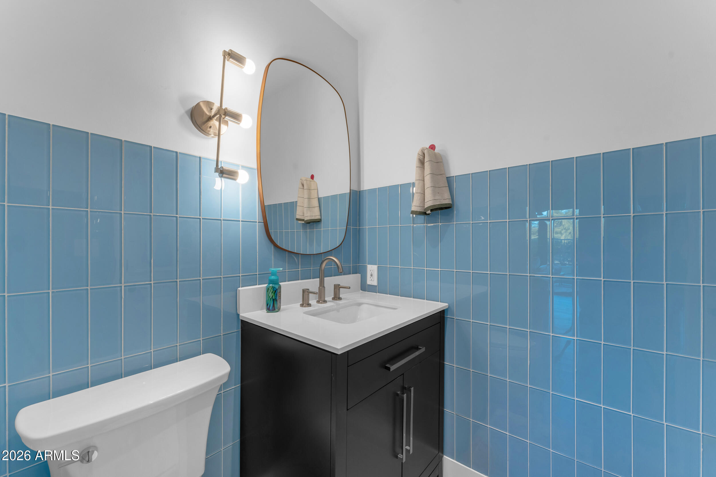 3908 East Alameda Lane Gilbert, AZ 85298 - Photo 45 of 62 a bathroom with a sink a toilet and a mirror