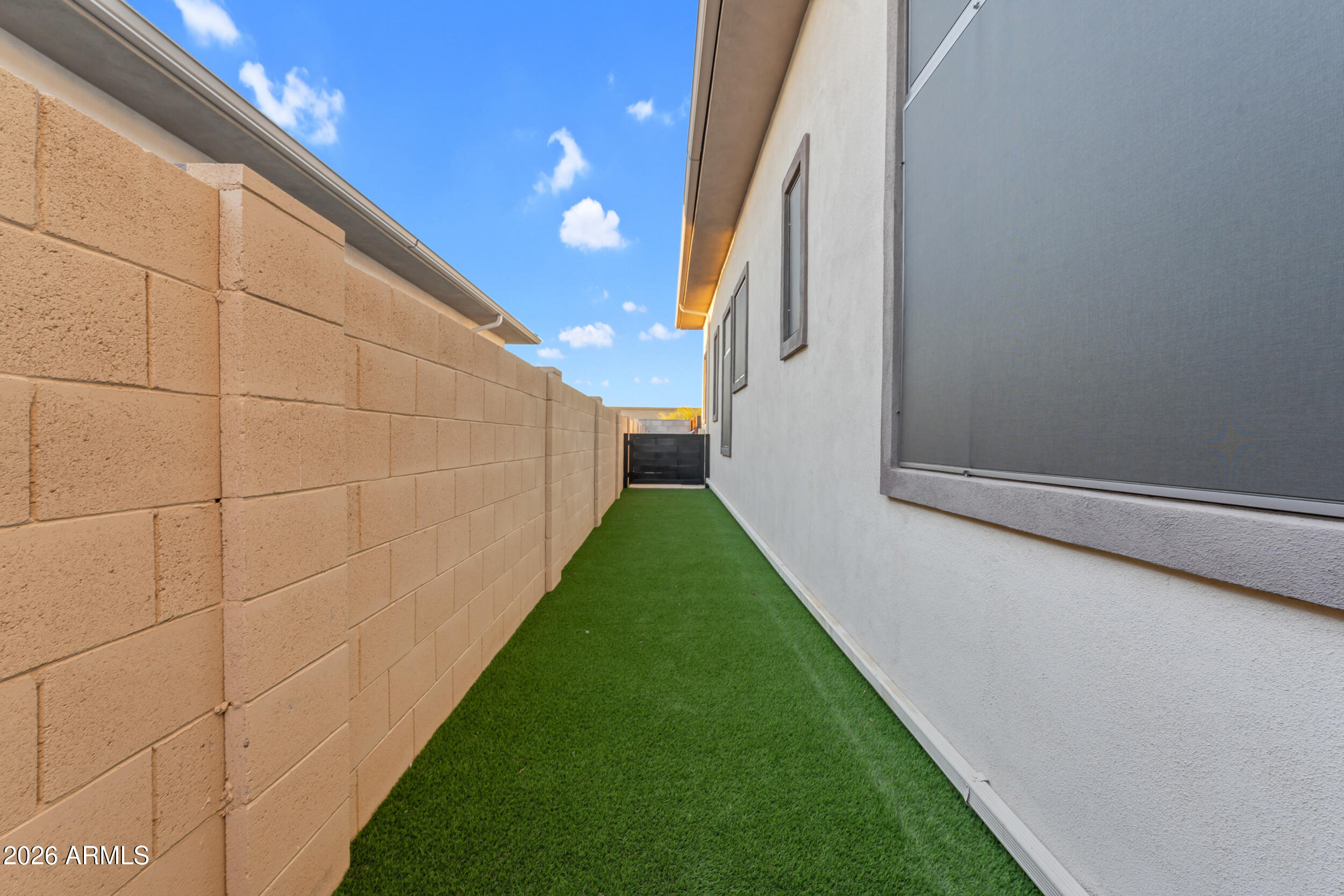 3908 East Alameda Lane Gilbert, AZ 85298 - Photo 49 of 62 a view of a back yard from a corridor