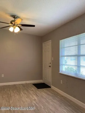 a view of an empty room with a window