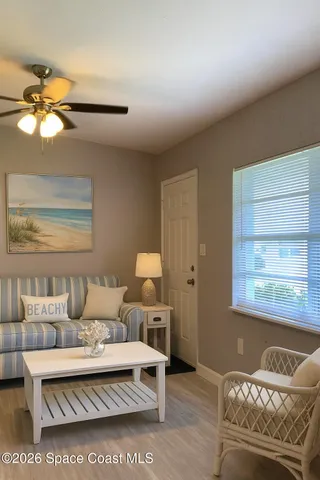 a living room with furniture and a window