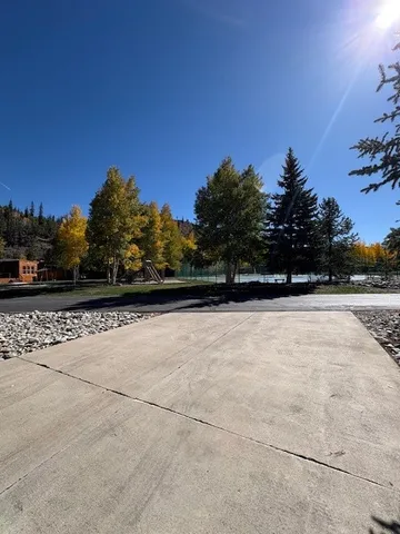 a view of yard with large trees