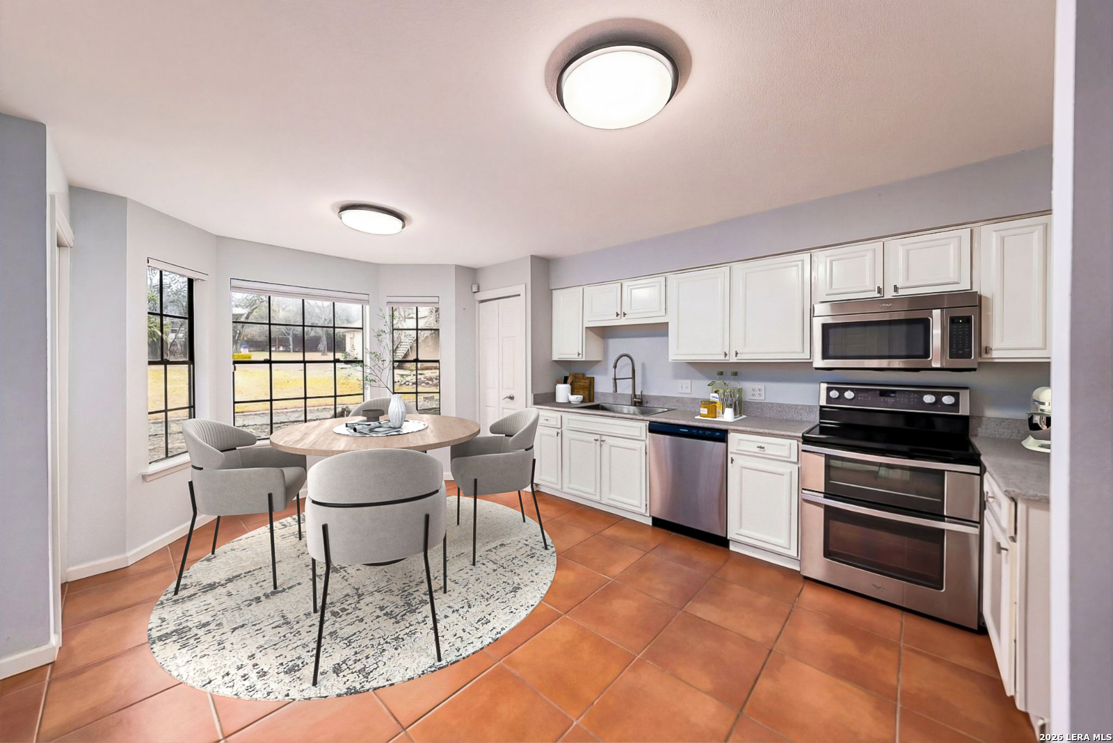 7711 Callaghan Road, Unit 805 San Antonio, TX 78229 - Photo 11 of 33 a living room with stainless steel appliances furniture a rug and a window
