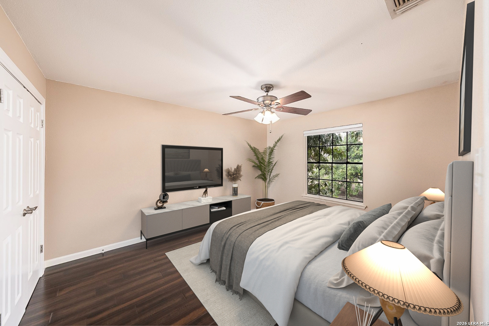 7711 Callaghan Road, Unit 805 San Antonio, TX 78229 - Photo 25 of 33 a bedroom with a bed and a flat screen tv