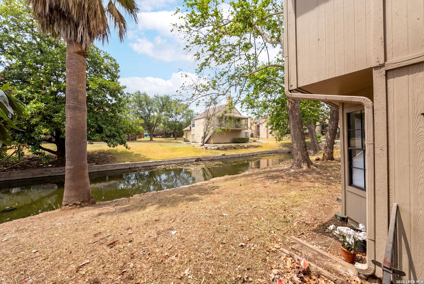 7711 Callaghan Road, Unit 805 San Antonio, TX 78229 - Photo 28 of 33 a view of a yard with wooden fence
