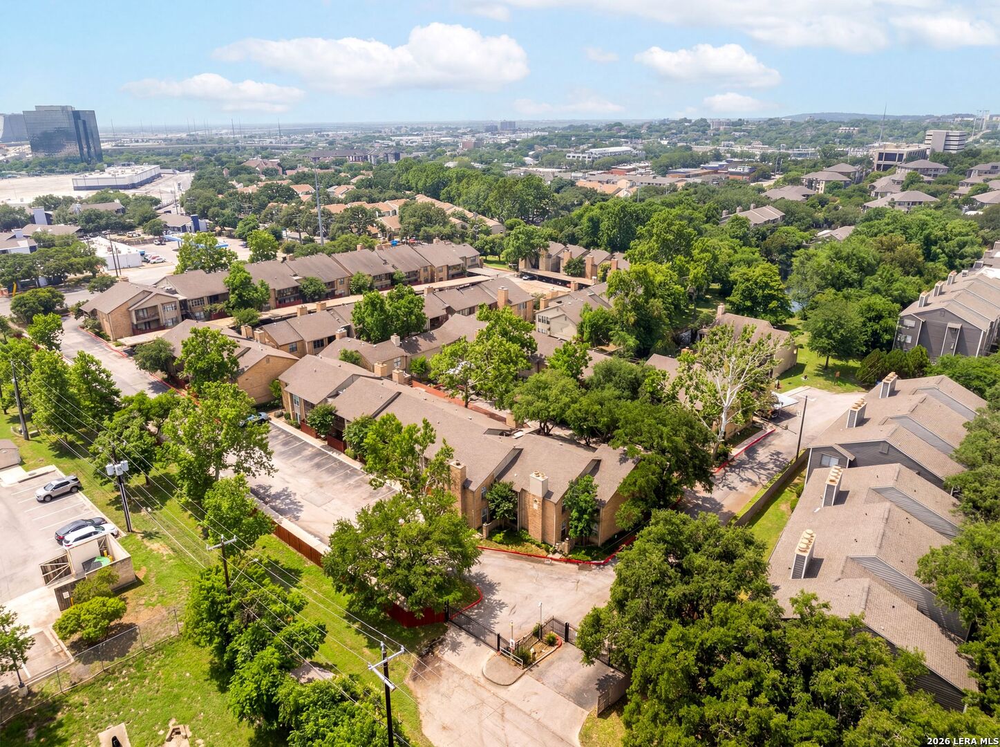 7711 Callaghan Road, Unit 805 San Antonio, TX 78229 - Photo 30 of 33 an aerial view of residential houses with outdoor space