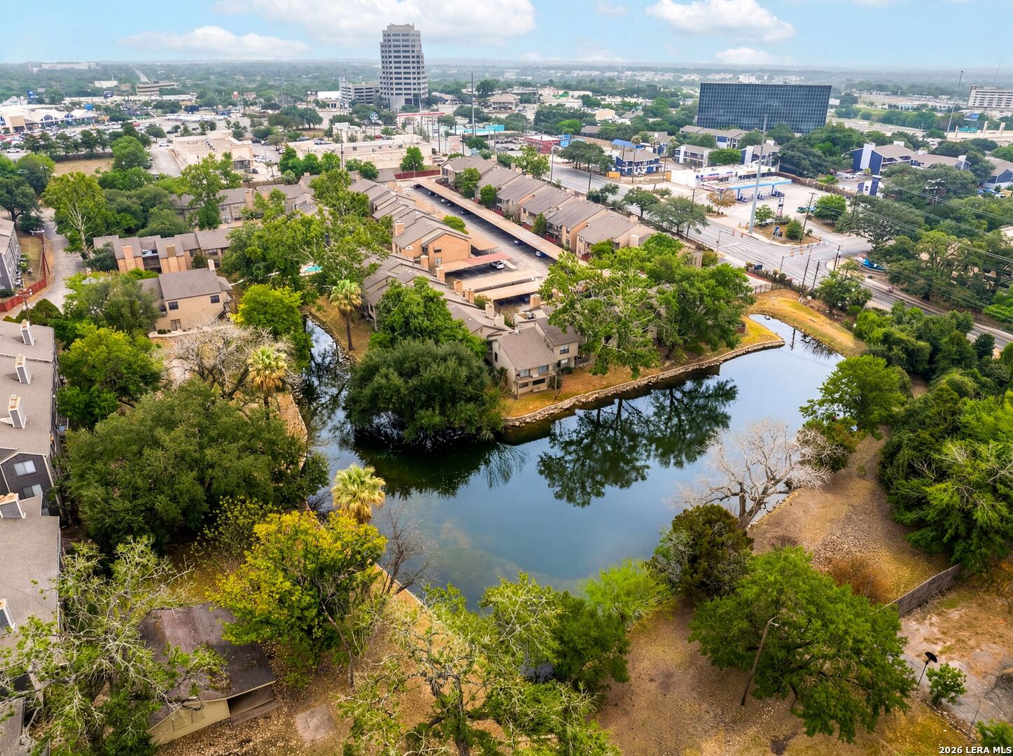 7711 Callaghan Road, Unit 805 San Antonio, TX 78229 - Photo 32 of 33 an aerial view of city and lake with trees