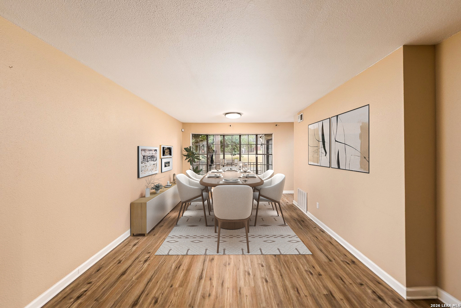 7711 Callaghan Road, Unit 805 San Antonio, TX 78229 - Photo 8 of 33 a dining room with wooden floor and white walls