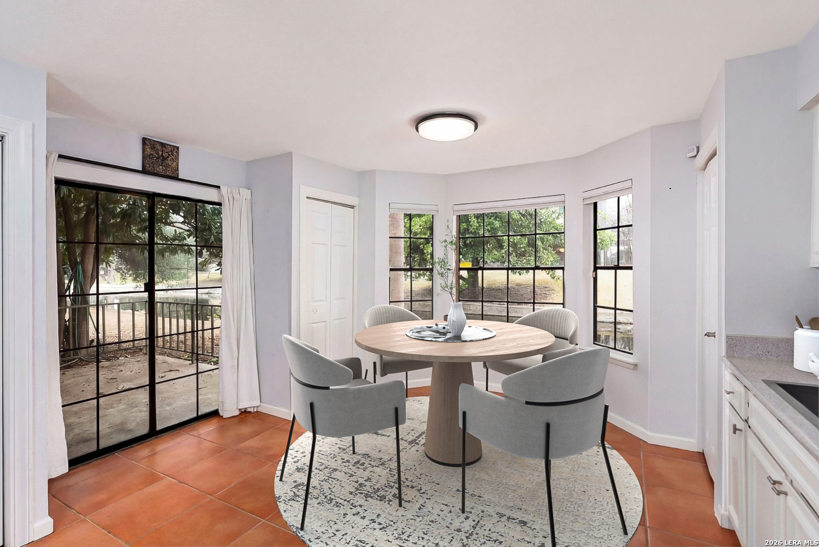 7711 Callaghan Road, Unit 805 San Antonio, TX 78229 - Photo 10 of 33 a view of a dining room with furniture wooden floor and a rug