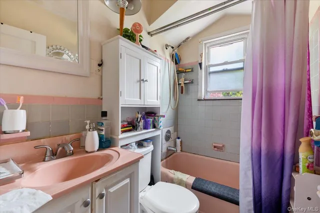 a bathroom with a sink toilet tub and shower