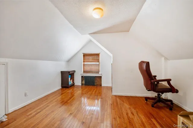 a workspace with furniture hardwood and a window