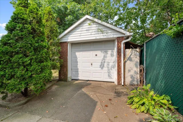 a view of a house with a yard and garage