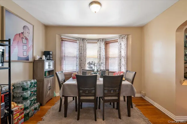 a view of a dining room with furniture and window