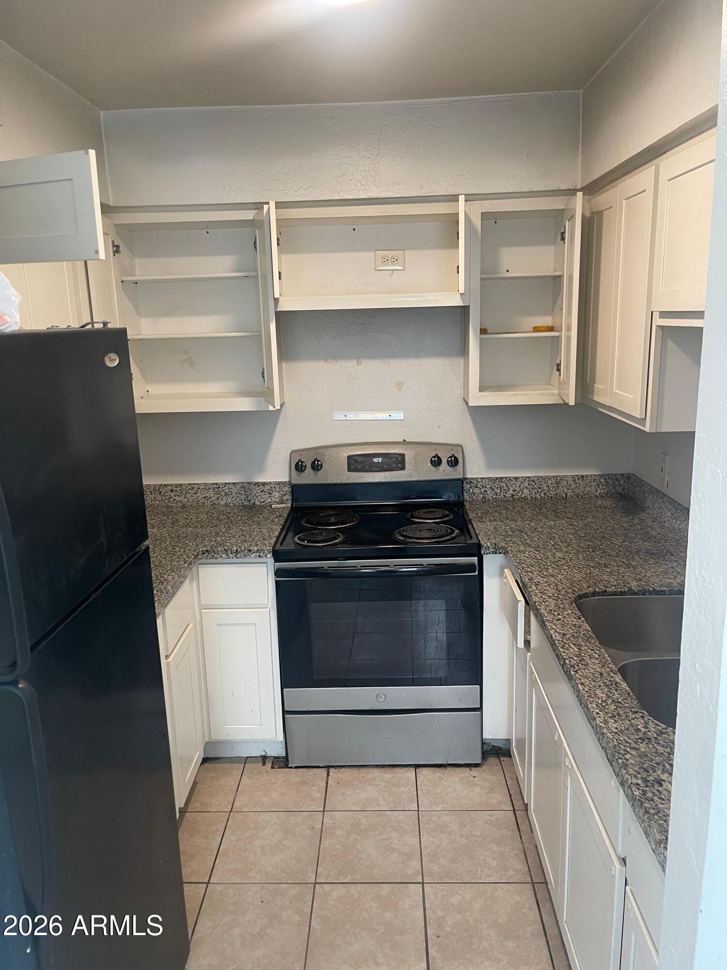 a kitchen with a stove and a sink