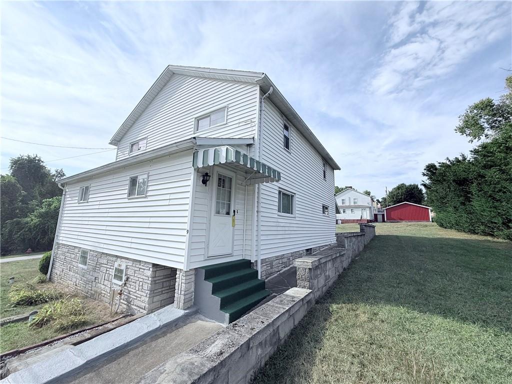 a front view of a house with garage