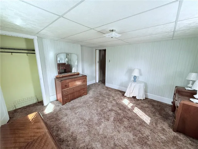 a view of an empty room and glass door