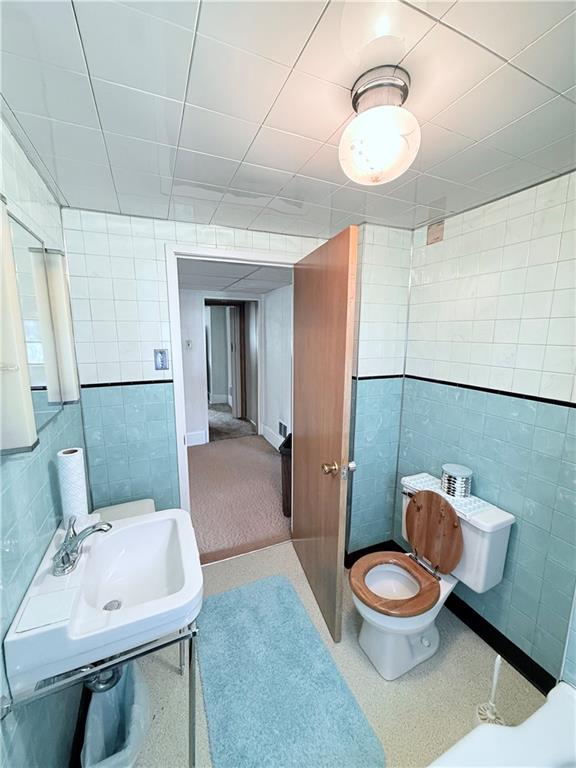 9 Kennedy Street Republic, PA 15475 - Photo 21 of 24 a bathroom with a sink a toilet and mirror