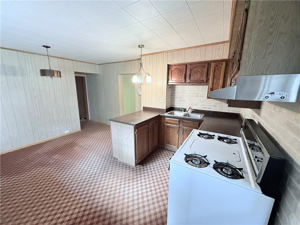 9 Kennedy Street Republic, PA 15475 - Photo 6 of 24 a kitchen that has a sink and a stove in it