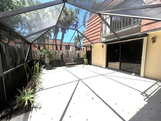 a view of a kitchen with a sink and chandelier