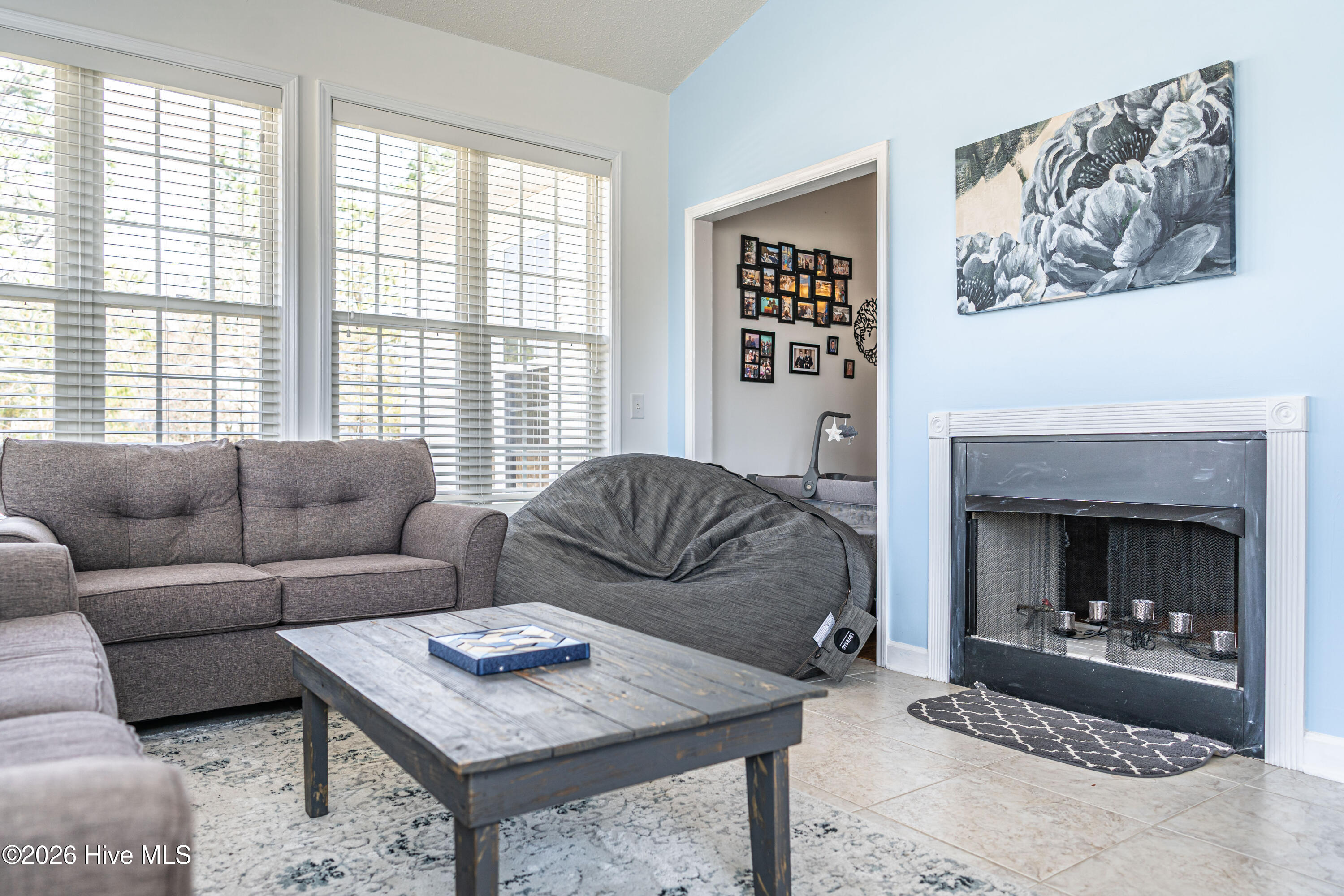 1320 Burning Tree Road Pinehurst, NC 28374 - Photo 22 of 60 Fireplace in Carolina Room opens to Living Room