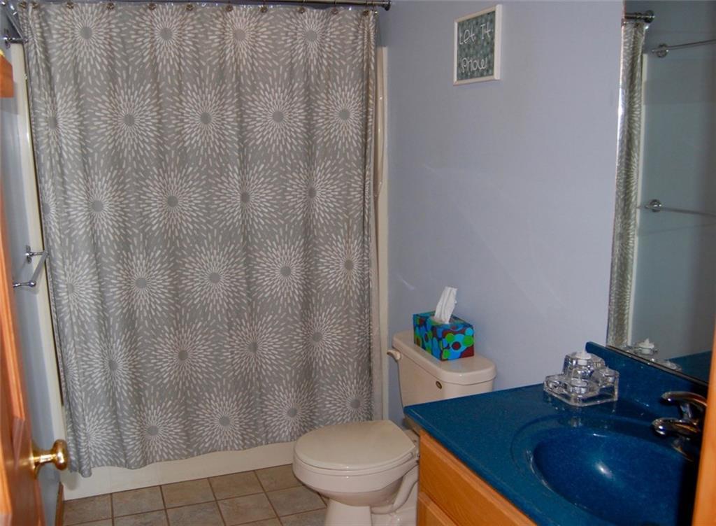 298 Carlton Pond Road Winthrop, ME 04364 - Photo 12 of 35 Down the hall you will find one of...
